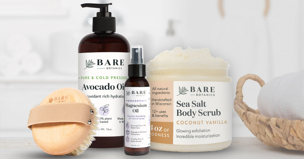 bare botanics best sellers on a counter dry brush avocado oil magnesium oil and coconut vanilla sea salt scrub